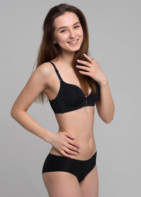 Svelte brunette teen Milana in sexy underwear exhibiting small tits and spreading her legs 